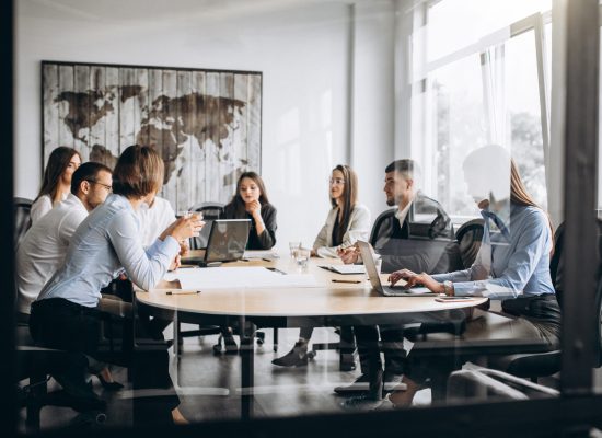 group-people-working-out-business-plan-office